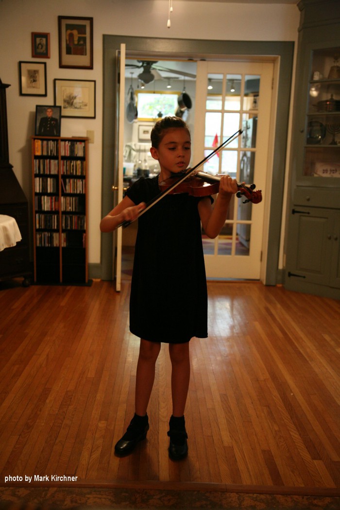 girl in black performing with excellent bow hand