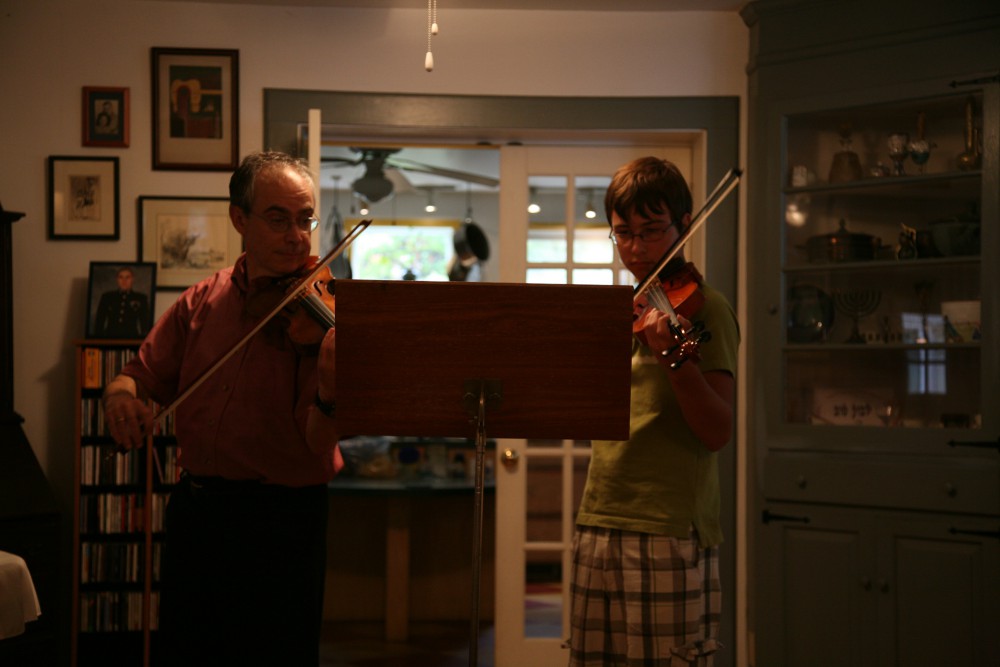 student and teacher performing Bartok Violin Duos together